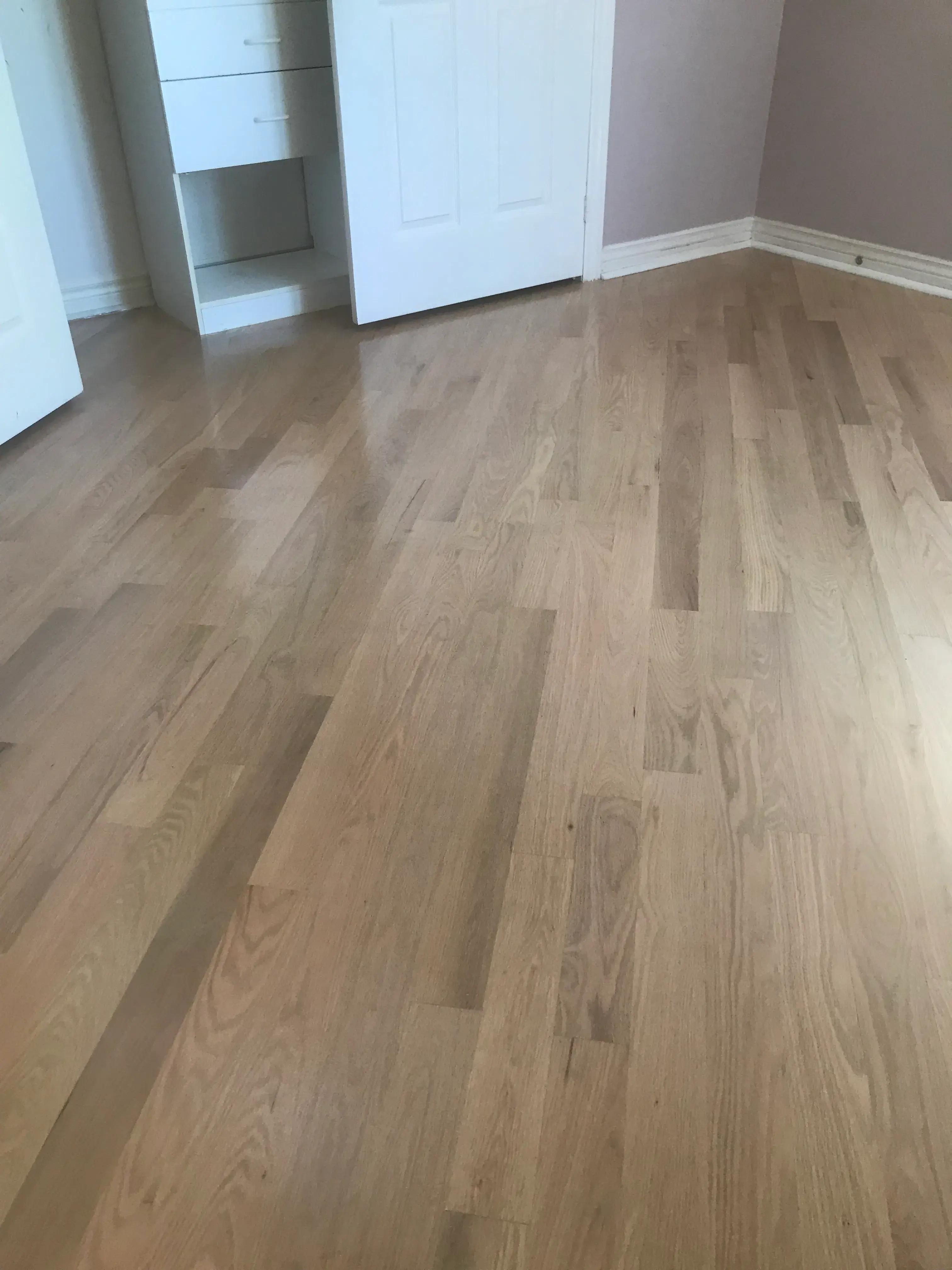 Natural oak floor finished in a bedroom