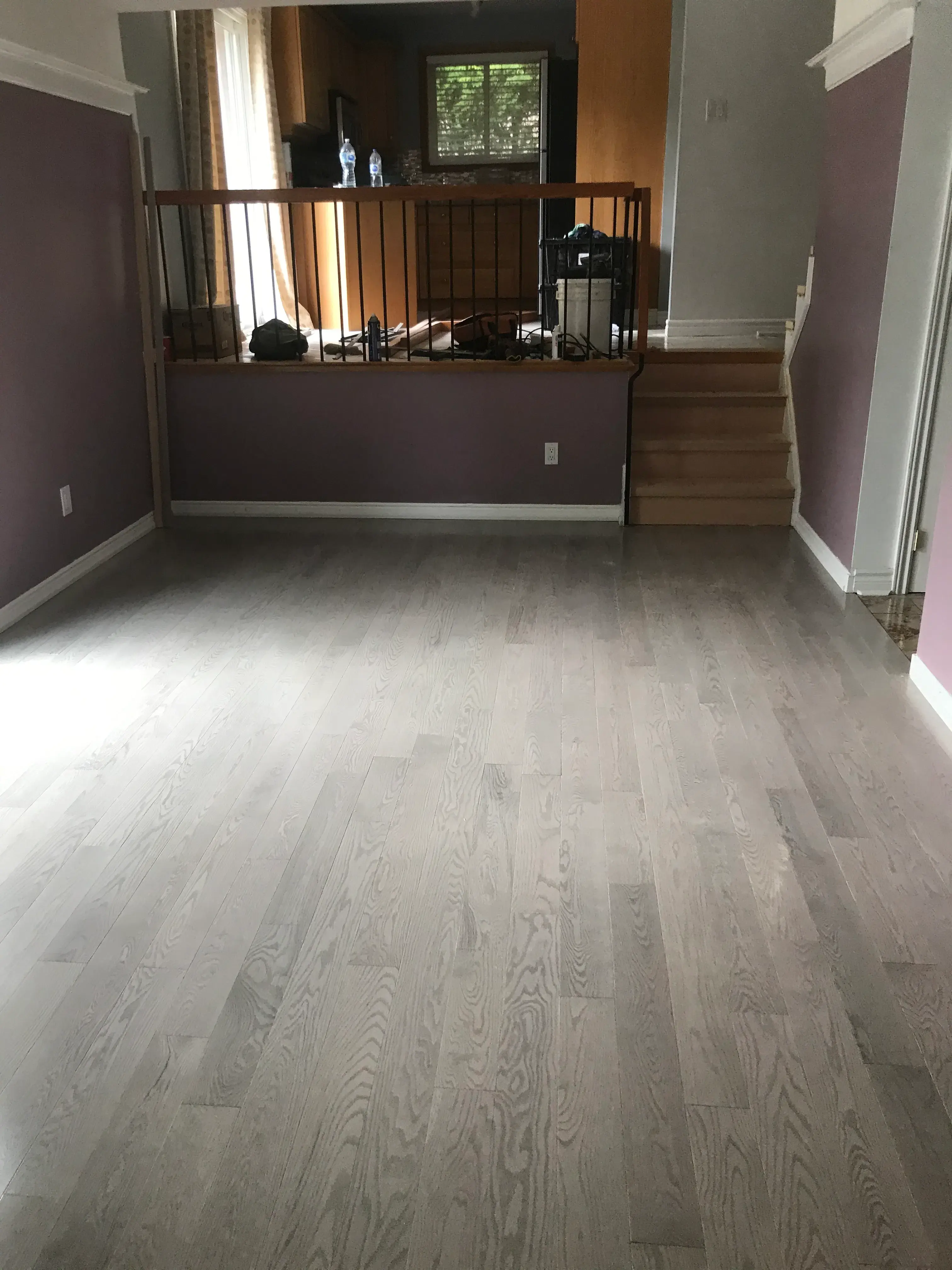 Light oak floor installed in an open living room